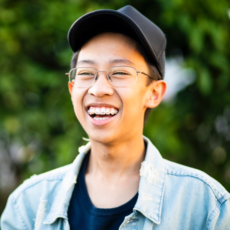 teen boy wearing traditional metal braces