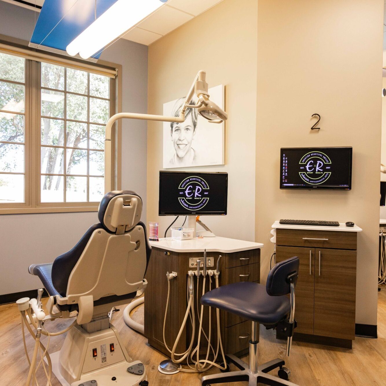Patient and orthodontic staff engaged during care at Jensen Orthodontic Arts